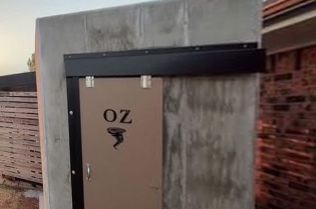 Before: bare, stained concrete storm shelter